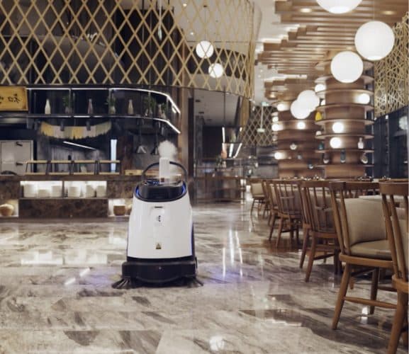 Autonomous cleaning robot operating in hospitality environment