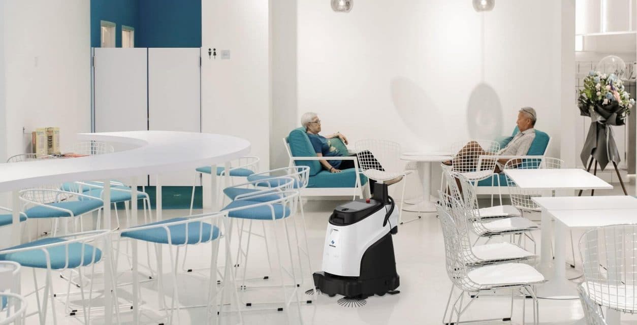Aged care facility with autonomous floor cleaning robot