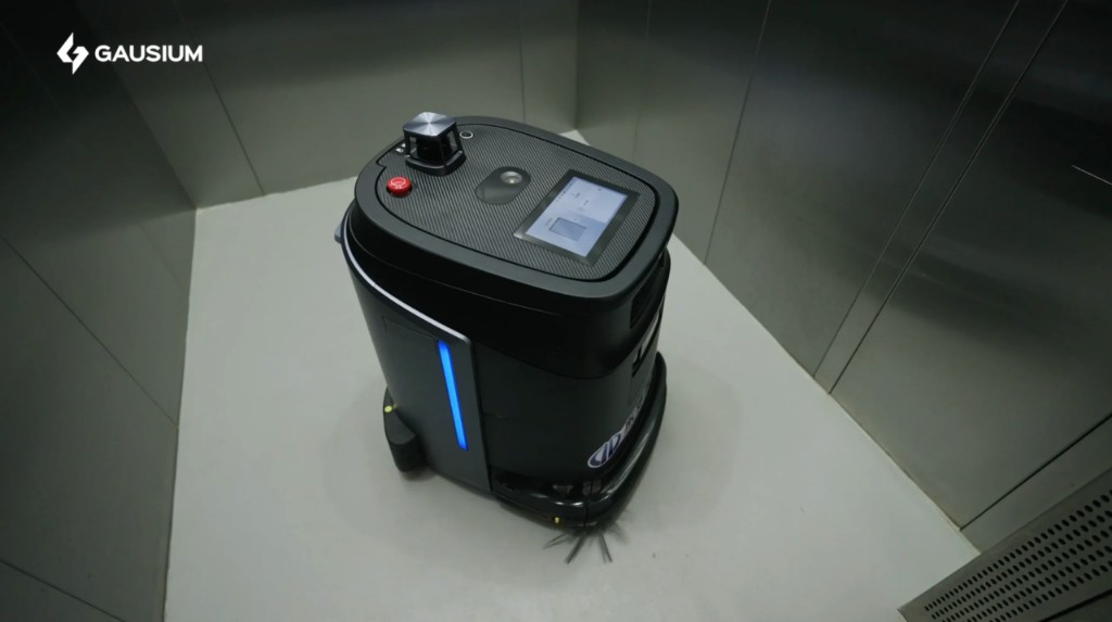 Gausium Phantas autonomously riding an elevator between floors